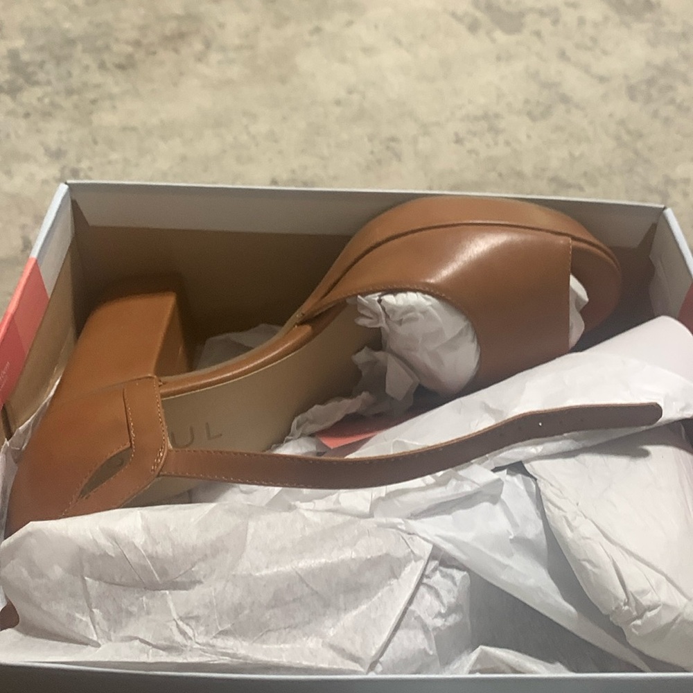 Beautiful tan peep toe heel .